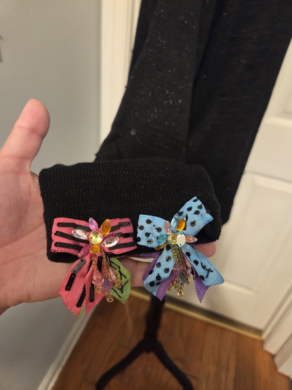 Black Crew Neck Sweater with Colorful Bow Accents - Picture 4 of 6